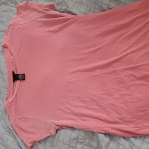 Speckled light coral shirt.